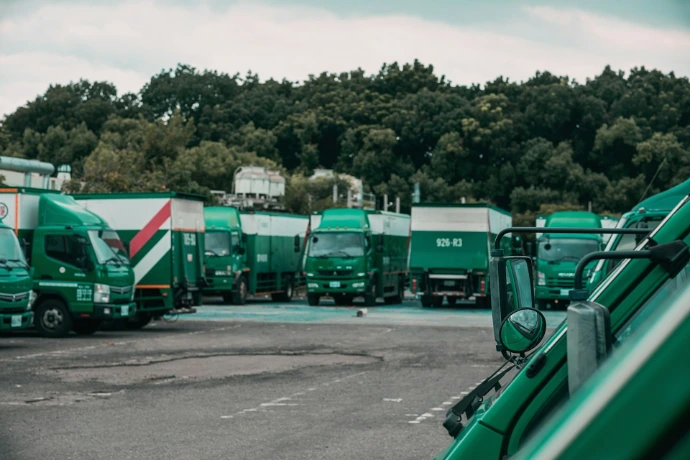 green and white truck on road during daytime